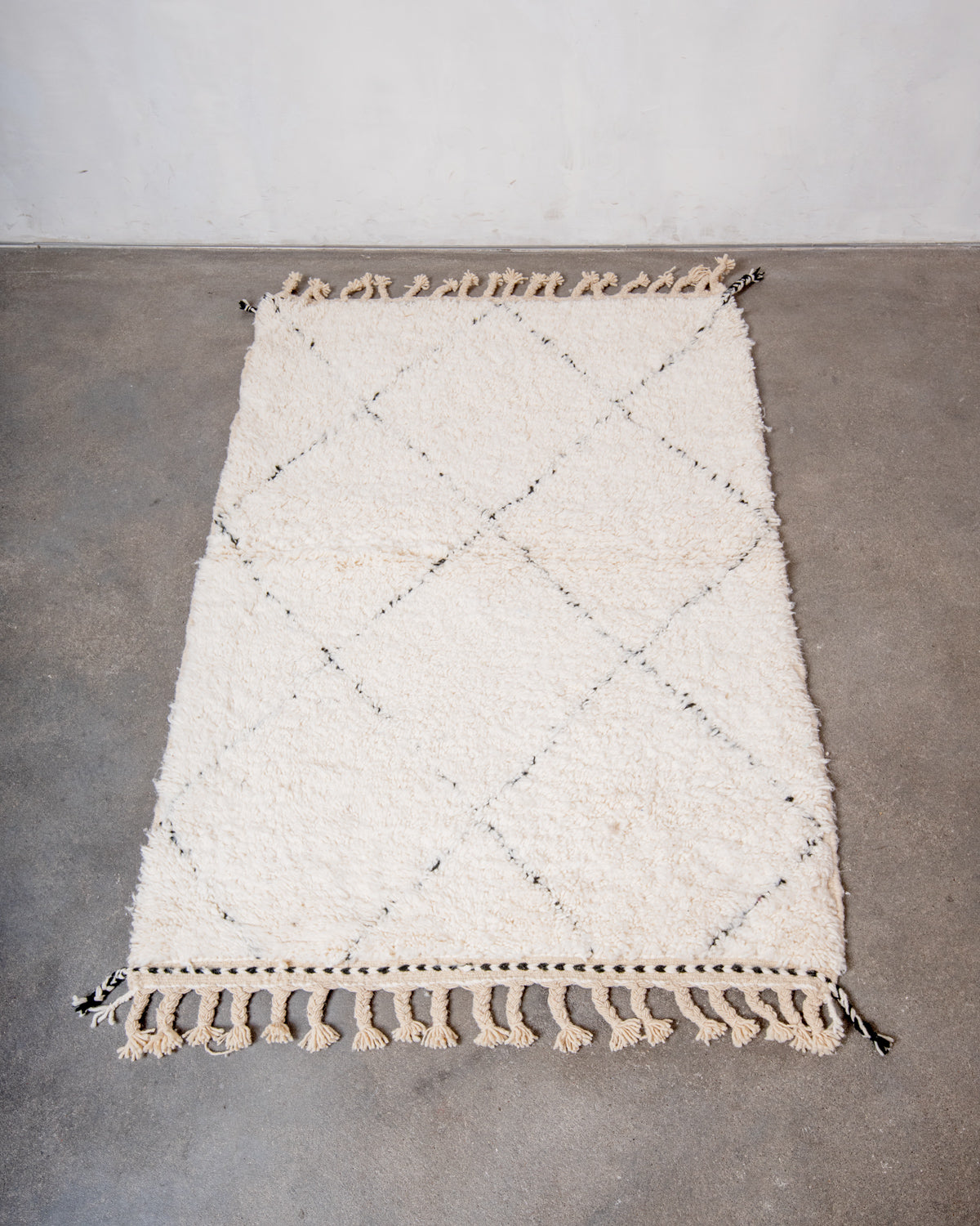 Modern, designer, handcrafted Berber rug from Morocco. Beniourain carpet with minimalist design, natural wool pile and a fluffy texture.